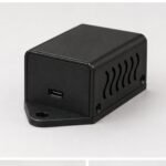 Compact matte black project box featuring side ventilation, USB-C port, and secure flange mounting points.